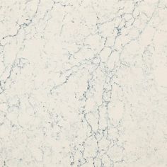 a white marble textured surface with blue streaks