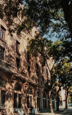 an old building with many windows and balconies