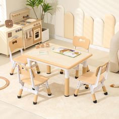 a child's table and chairs in a playroom with toys on the floor