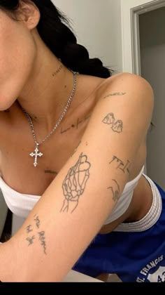 a woman with a cross on her arm