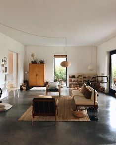 the inside of a coffee shop with tables and chairs