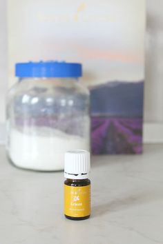 a bottle of essential oils sitting on a counter