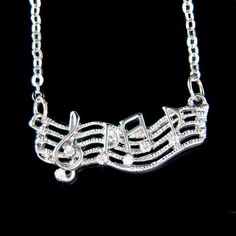 PERFECT GIFT FOR MUSIC FANS, INSTRUCTOR, TEACHER OR STUDENT!!Great Gift for Bride who are musician.This sparkling Crystals TREBLE CLEF music melody pendant with Swarovski crystals measuring 1 1/16"  (27mm) wide X 7/16"  (6mm) high. It comes with a FREE 16.5" inch (41.7cm) rhodium plated fine cable chain necklace with lobster clasp (plus 2" extender chain). Crystal Color: Crystal ClearGreat piece for your collection!===================Prices are in US$.For shipping policies and other important in Musical Jewelry, Cable Chain Necklace, Music Jewelry, Jewelry Accessories Ideas, Treble Clef, Musical Note, Accessories Ideas, Music Note, Brooch Jewelry