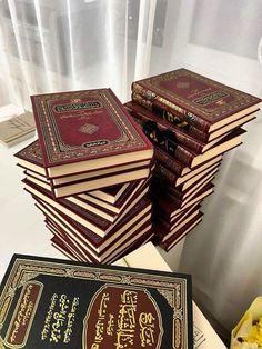 a stack of books sitting on top of a table