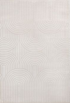 a white rug with an abstract design on the bottom, and a circular pattern in the middle