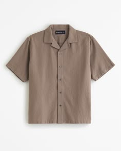 Comfortable short-sleeve button-up shirt in a soft cotton fabric and relaxed-fit silhouette, featuring a resort-style camp collar, all-over waffle texture and straight hem. Men’s Button Up Shirt Casual, Mens Abercrombie Outfits, Everyday Relaxed Fit Button-up Camp Shirt, Cotton Camp Shirt Button-up, Cheap Relaxed Fit Button-up Camp Shirt, Solid Button-up Camp Shirt With Buttons, Brown Button-up Camp Shirt, Mens Abercrombie, Button Up Shirt Men