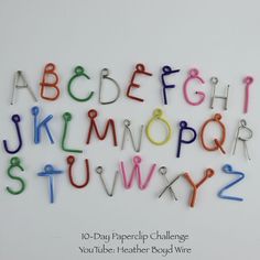 the letters and numbers are made out of colored paperclips