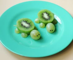 two pieces of kiwi fruit on a blue plate