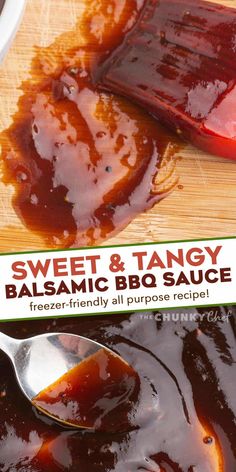 a spoon full of bbq sauce sitting on top of a wooden cutting board