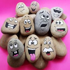 a pile of rocks with faces painted on them