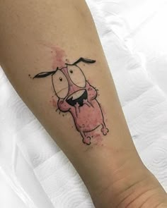 a person with a tattoo on their leg that has a dog in the middle of it