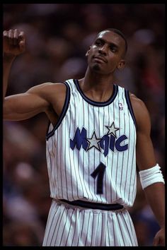 an image of a professional basketball player about to throw the ball during a game in which he is holding his fist up