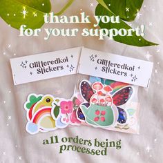 some stickers are sitting on top of a sheet of paper with the words, thank you for your support