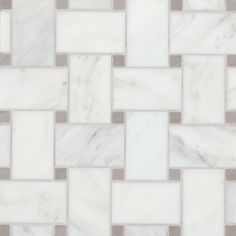 a white and grey tile pattern that looks like it is made out of marble blocks