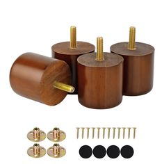 three wooden knobs with screws and nuts in front of them on a white background