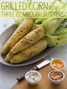 grilled corn with three compound butters on a plate next to two small bowls