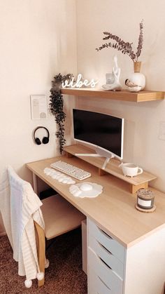 a desk with a computer on top of it