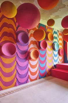 an artisticly designed room with brightly colored walls