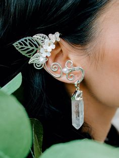 The fantasy inspired look you have been searching for. Our Wire Wrapped Elf Ears create the playful illusion of elf ears while standing out with a complete wrap around design accented with natural cascading quartz crystals. The wire is the perfect thickness to allow for flexibility to fit around all ear sizes. Our quartz wrap around elf ears are unique, glamorous, comfortable and durable allowing for many events of fantasy filled fun. SIZE: One size fits all with adjustable wire CRYSTAL LENGTH: Dragon Ear Cuffs, Elf Ear Cuff, Fairy Ears, Crawler Earrings, Elven Jewelry, Ear Crawler, Ear Crawler Earrings, Crawlers Earrings, Elf Ears