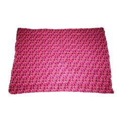 a pink and purple pillow on a white background