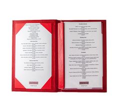 an open red menu with white writing on the front and back pages, sitting in a red leather case