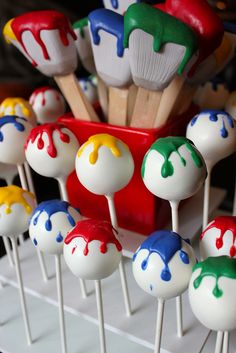 cake pops with paint splattered on them