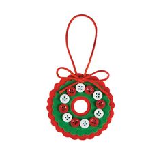 a christmas ornament hanging from a red ribbon with buttons on it's side