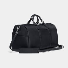 Stuart & Lau | The Monaco - Men's Weekender Bag - Black Luxury Weekender Bag With Leather Handles For Weekend Trips, Black Leather Trim Duffle Bag For On-the-go, Classic Weekender Bag With Luggage Sleeve For Travel, Luxury Weekender Bag For Overnight Trips, Luxury Weekender Bag With Leather Handles For Travel, Luxury Black Travel Accessories For On-the-go, Classic Everyday Travel Accessories With Leather Trim, Modern Weekender Bag With Top Carry Handle For Trips, Black Coated Canvas Duffle Bag For Everyday