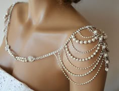 a mannequin with pearls and chains on it