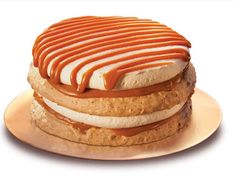 there is a sandwich with peanut butter and ice cream on it that has been drizzled with caramel