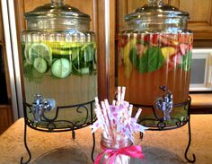 two glass jars filled with different types of fruit and veggies on top of a counter