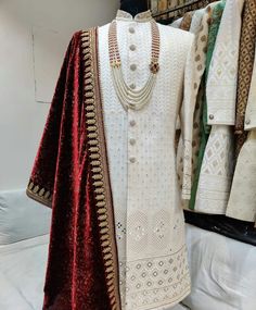 a white and red outfit on display in a store