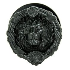 a black lion head on a white background with an ornate frame around it's face