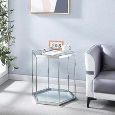 a living room with a chair, table and clock on the wall next to it