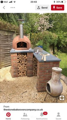 an outdoor brick oven with logs stacked in it