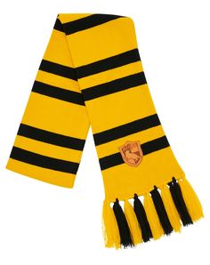 Bundle up for your next trip to Weasleys’ Wizard Wheezes for your favorite magical gifts! This officially licensed yellow and black striped knit scarf features Hufflepuff’s signature house crest and dangling fringe ends. Officially licensed Material: Acrylic Care: Hand wash Imported Weasleys Wizard Wheezes, Hufflepuff Scarf, Wizard Wheezes, Magical Gifts, Magical Gift, S Signature, Yellow And Black, Spirit Halloween, Knit Scarf