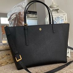 New Tory Burch Emerson Tote 100% Authentic Guaranteed Description 100% Authentic Tory Burch #136091 0522 Emerson Small Tote Black And Gold Hardware **Brand New With Tags** 15.5”Top L, 12”Bottom L X 9.5” H X 4” W Adjustable Handles 7” Drop When Adjusted To The Longest Long Strap Included Black And Gold Hardware, Tory Burch Perry Tote, Tory Burch Ella Tote, Tory Burch Emerson, Tan Tote Bag, Orange Tote Bags, Ella Tote, Plaid Tote Bag, Slouchy Tote