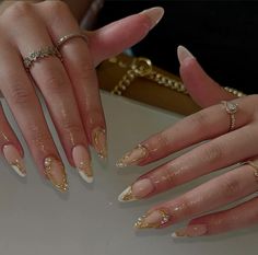 White Pearl Nails With Gold, Elegant Nye Nails, Golden Nail Extension, White And Gold Oval Nails, Simple Ethereal Nails, Gold-accented Nail Inspiration, Gold And White Almond Nails, Gold Detailed Nails, Graduation Nails Gold