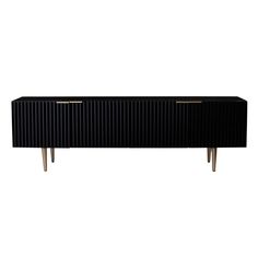 a black sideboard with two brass legs