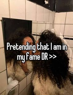 a woman taking a selfie in front of a mirror with the caption pretending that i am in my fame dr