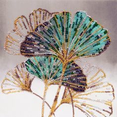 an image of a flower made out of beaded wire and beads on a white background