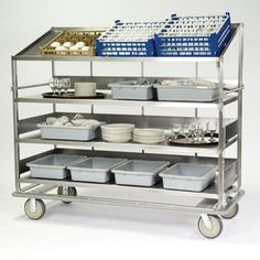 a metal shelf with trays and bowls on it