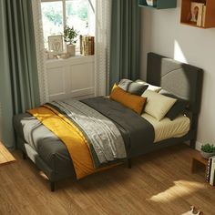 a bedroom with wood floors and green curtains