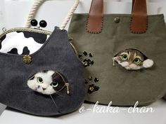 two purses with cats peeking out of them, one is green and the other is brown