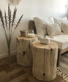 two wooden stools sitting next to each other on top of a hard wood floor