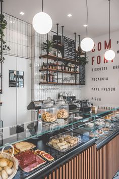 the food is on display in the glass case behind the counter at the restaurant's front window