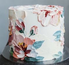 a close up of a cake with flowers on it