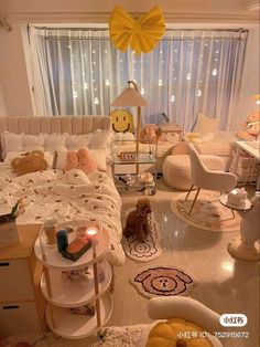 a bed room with a neatly made bed and lots of pillows on the floor next to a window