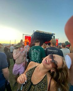 a group of people standing next to each other at a music festival