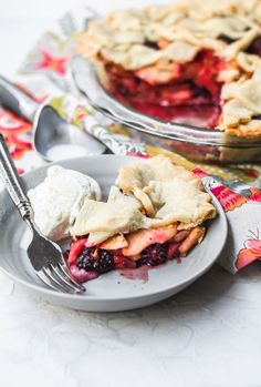 two plates with pies on them, one has ice cream and the other has berries